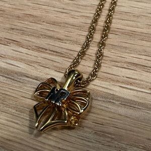 Nina Ricci Vintage Gold-Plated Bow Logo Necklace (1980s–1990s)